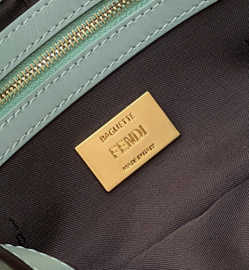 BAGUETTE WITH FF MOTIF 27 IN VIRIDIAN GREEN SOFT LAMBSKIN GOLD HARDWARE